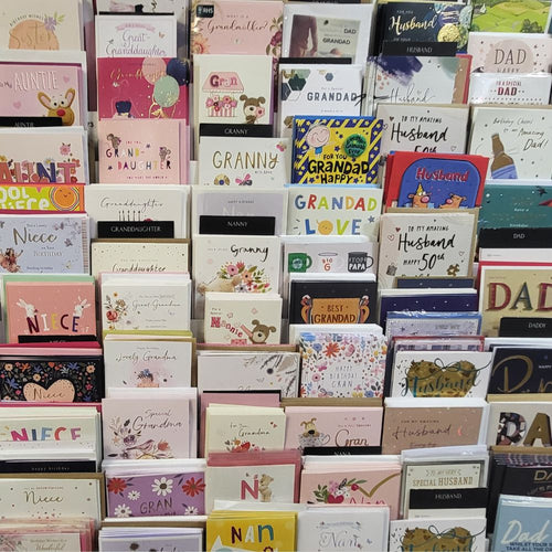Display of various greeting cards with different designs and text.