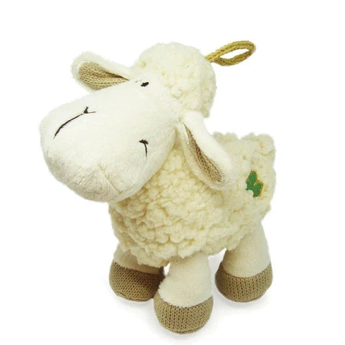 Plush sheep toy with a green tag 